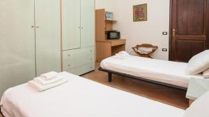 Postel nebo postele na pokoji v ubytování Casa Luisa - Pan di Zucchero - Nebida