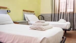 Postel nebo postele na pokoji v ubytování Casa Luisa - Pan di Zucchero - Nebida