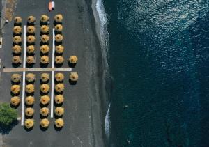 an aerial view of a parking lot next to the water at Villa Mare Angelica in Perivolos
