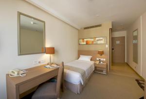 Letto o letti in una camera di The Salisbury - YMCA of Hong Kong