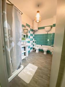 a bathroom with a shower and a toilet and a sink at 35 Passi dal mare B&B in Cirò Marina