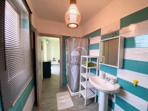 a bathroom with a sink and a shower at 35 Passi dal mare B&B in Cirò Marina