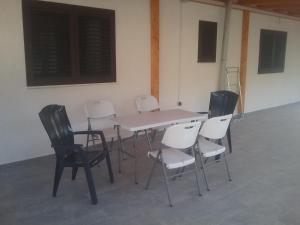 a table and chairs in a room at MILDA+M in Skradin