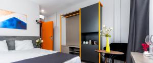 Postel nebo postele na pokoji v ubytování Lorem Hotel