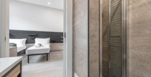 A bed or beds in a room at Ichnusa Rooms
