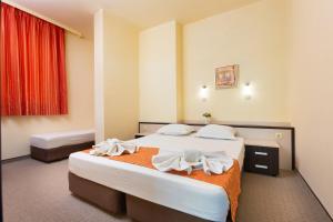 Postel nebo postele na pokoji v ubytování Hotel Julia
