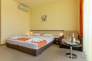 Postel nebo postele na pokoji v ubytování Hotel Julia