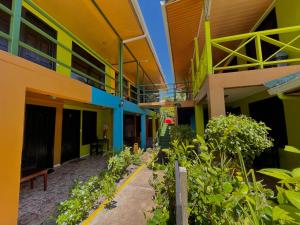 an empty courtyard of a building with plants at Hotel El Icaco Tortuguero in Tortuguero