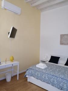 Posteľ alebo postele v izbe v ubytovaní Corte Barone