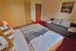 Ein Bett oder Betten in einem Zimmer der Unterkunft VIP Apartmany Besenova
