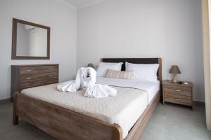 Posteľ alebo postele v izbe v ubytovaní Fotini Apartments