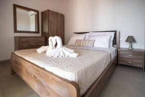 Posteľ alebo postele v izbe v ubytovaní Fotini Apartments