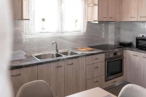 Kuchyňa alebo kuchynka v ubytovaní Fotini Apartments