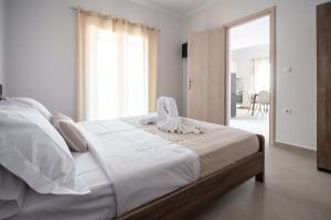 Posteľ alebo postele v izbe v ubytovaní Fotini Apartments
