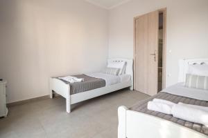 Posteľ alebo postele v izbe v ubytovaní Fotini Apartments