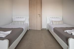 Posteľ alebo postele v izbe v ubytovaní Fotini Apartments