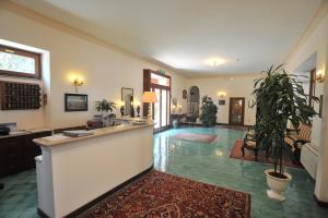 a lobby with a bar and a living room at Hotel Belvedere in Conca dei Marini