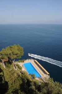 an overhead view of a swimming pool next to the ocean at Hotel Belvedere in Conca dei Marini