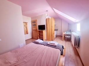 Posteľ alebo postele v izbe v ubytovaní Woodland - Apartments & SPA Łagów