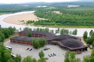 an aerial view of a building next to a river at Hotel Ivalo in Ivalo
