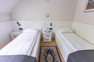 Säng eller sängar i ett rum på Zajazd Gołębiowski