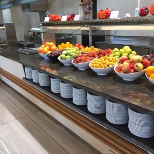 a display of fruits and vegetables on a counter in a kitchen at Prestige Fort Beach Private Apartment-Studio 46 in Sveti Vlas