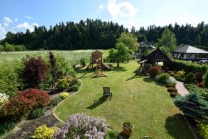 an aerial view of a garden with a playground at AGROTURYSTYKA POD ŚWIERKAMI in Hużele