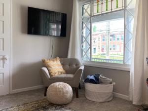 a living room with a chair and a window at Hyde Park Hideaway - Close to Square & Downtown! in Cincinnati