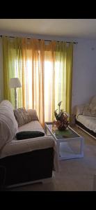 A bed or beds in a room at Ático Roquetas