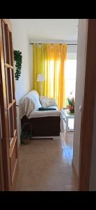 A bed or beds in a room at Ático Roquetas