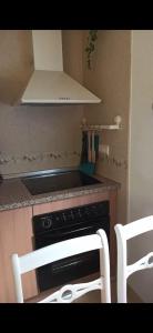 A kitchen or kitchenette at Ático Roquetas