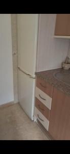 A kitchen or kitchenette at Ático Roquetas
