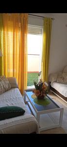 A bed or beds in a room at Ático Roquetas