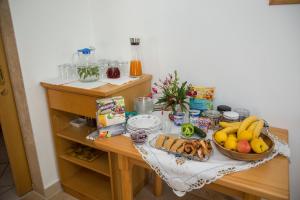 a table with a bunch of food on it at Gästehaus Grasch in Kitzeck im Sausal