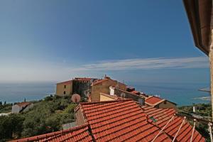 a view of a town with red roofs at Albachiara home - vista mare in Cipressa