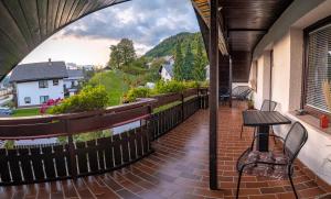 a balcony with a table and chairs and a view at APARTMA VESTER - Large 3-Bedroom Near Bled in Bled