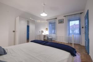 a bedroom with a large bed in a room at Kuća za odmor Tonka in Grižane
