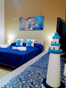 Ένα ή περισσότερα κρεβάτια σε δωμάτιο στο Appartamento Turistico L'Ancora