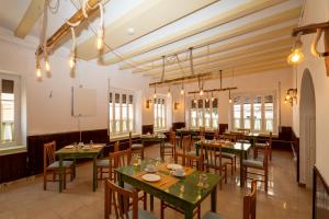 a large dining room with tables and chairs at P&R hostals Can Tort in Tossa de Mar