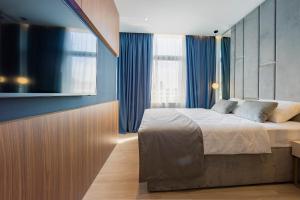 Posteľ alebo postele v izbe v ubytovaní Caldo Luxury Rooms