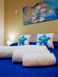 Ένα ή περισσότερα κρεβάτια σε δωμάτιο στο Appartamento Turistico L'Ancora