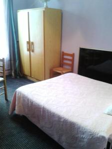Cama o camas de una habitación en Hôtel Printania