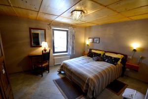 Cama o camas de una habitación en Maison Du-Noyer Chambres et Tables d'Hotes