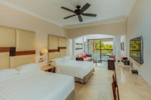 Postel nebo postele na pokoji v ubytování Barceló Maya Caribe - All Inclusive