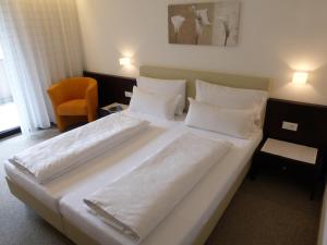 Una cama o camas en una habitación de Garni Weghueb
