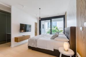 Postel nebo postele na pokoji v ubytování Luxury Villa Complex