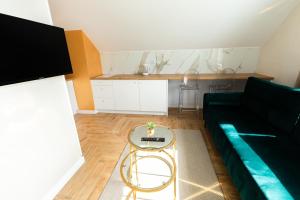Kuchyňa alebo kuchynka v ubytovaní Stylowe Apartamenty Plewiska