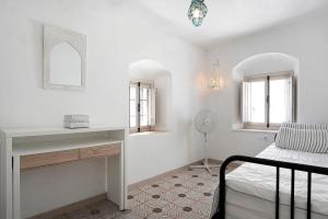 A bed or beds in a room at Precioso apartamento en Vejer con terraza