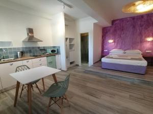 Postel nebo postele na pokoji v ubytování Villa Nena - Studio Suites