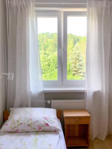 Posteľ alebo postele v izbe v ubytovaní Między górami. Apartament w Cisnej